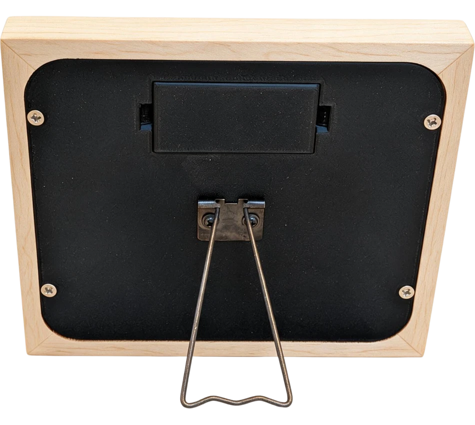 The back of Mindrise in maple, showing the battery door and the fold-out stand