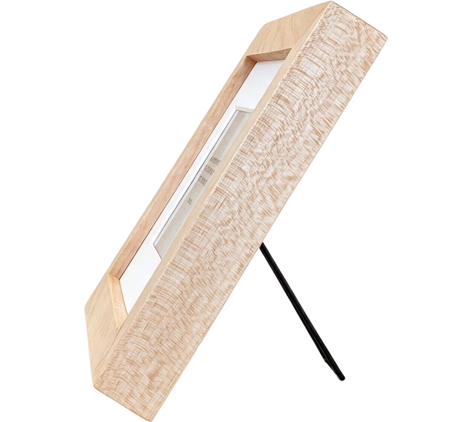 Mindrise in maple, seen from the side on its fold-out stand, showing how slim the frame is