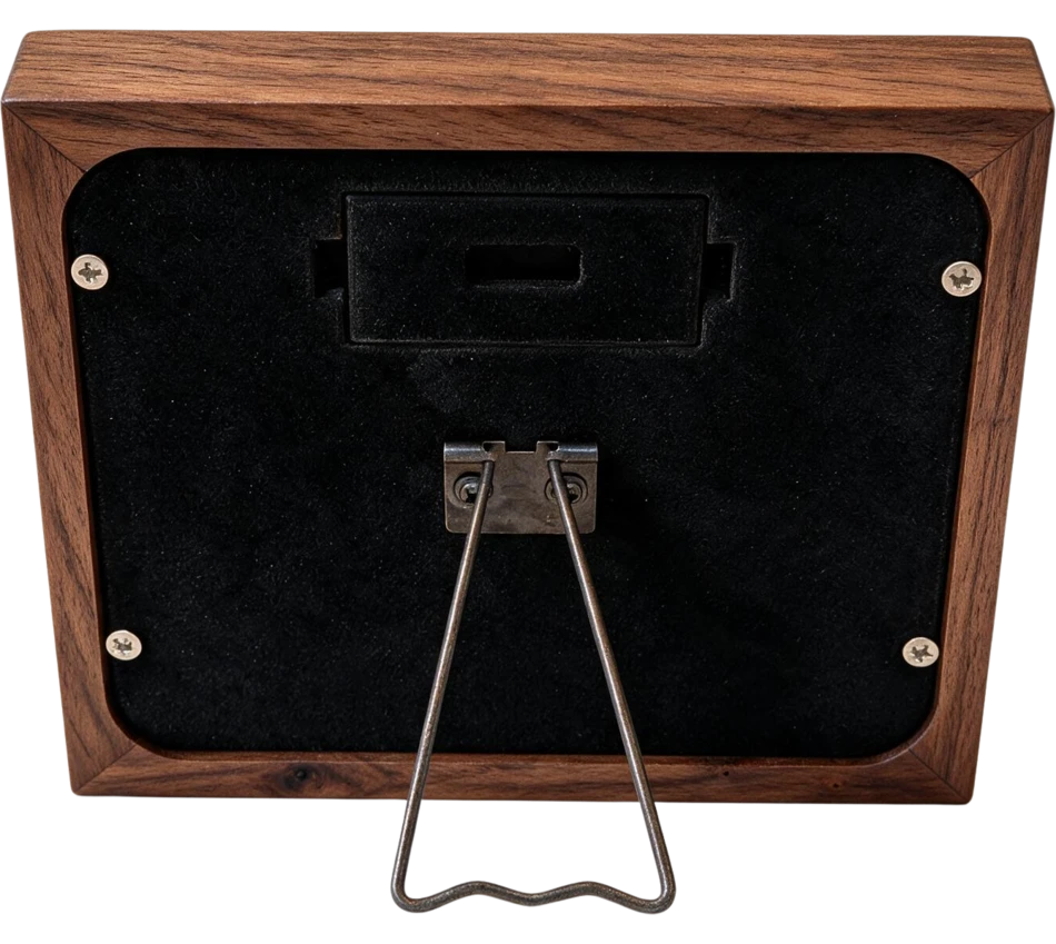 The back of Mindrise in walnut, showing the battery door and the fold-out stand