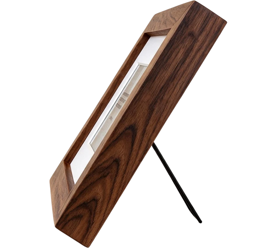 Mindrise in walnut, seen from the side on its fold-out stand, showing how slim the frame is